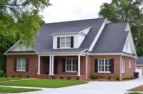 charcoal metal roof on red brick house|black roof for red brick house.